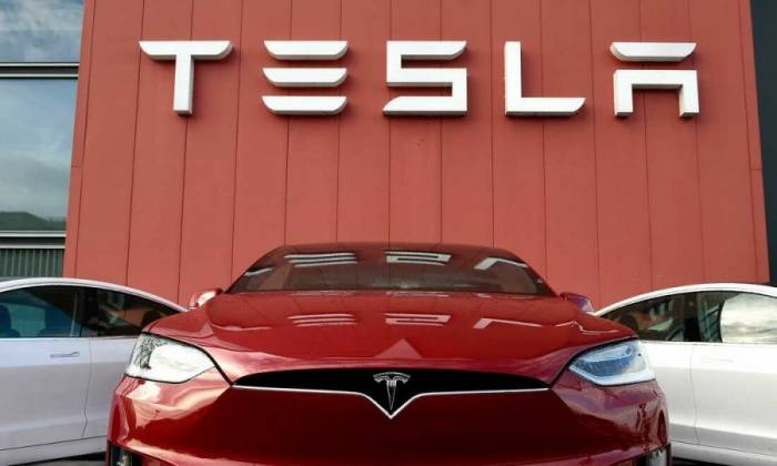 Tesla's profits plunge amid price cuts and slower vehicle sales