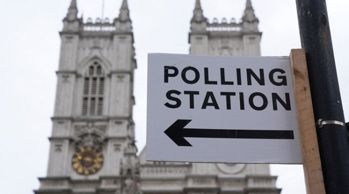 Millions of UK voters start casting ballots in general election 
