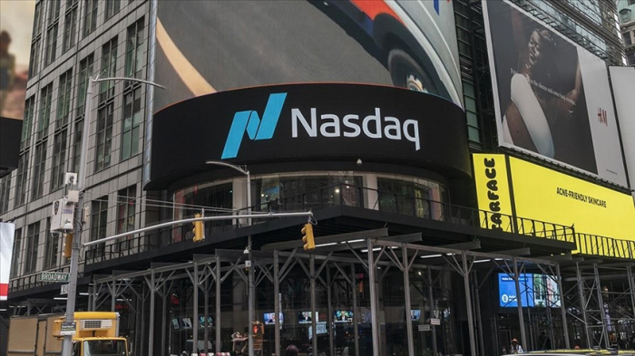 Nasdaq, S&P 500 surge to record highs