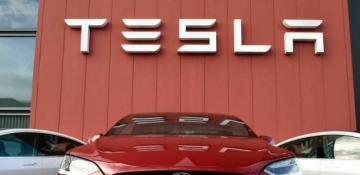 Tesla's profits plunge amid price cuts and slower vehicle sales