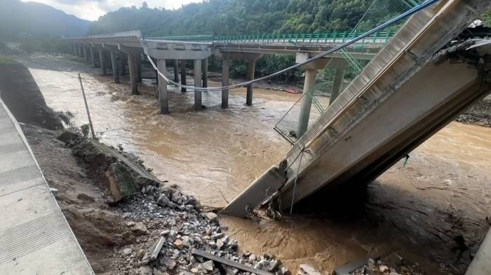 Floods, mudslides kill 2 in southwest China, destroy homes, bridge 