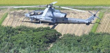 U.S. military helicopter crash lands in Japan rice paddy
