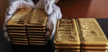 Gold eases after hitting record high above $2,500