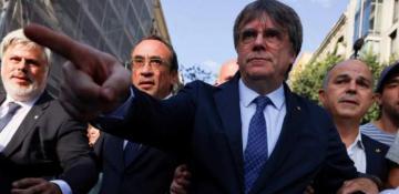 Police hunt ex-Catalan separatist leader after shock return from exile 