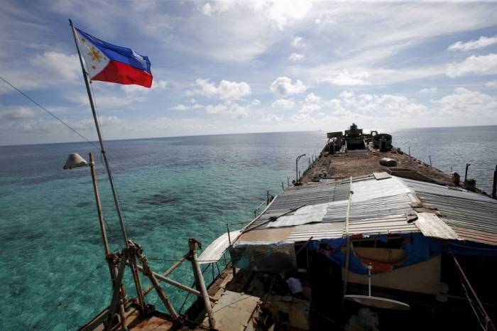 Philippines withdraws coast guard vessel from South China Sea shoal 