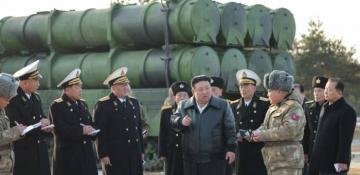 North Korea’s Kim oversees test-firing of new multiple rocket launcher