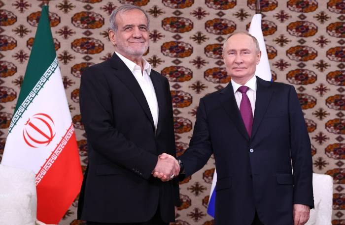 Iran's president meets with Putin, labeling their ties as strategic 