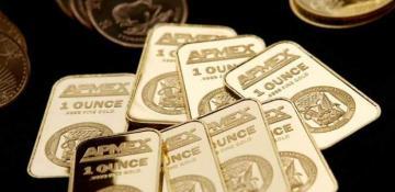 Gold hovers near record high on safe-haven demand 