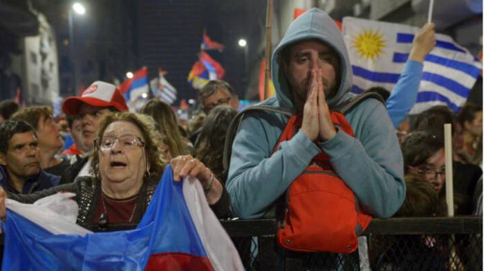 Uruguay holds a tight runoff election to choose its next president 