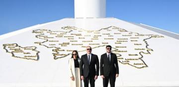 President Ilham Aliyev raises Azerbaijan's tricolor flag at National Flag Square