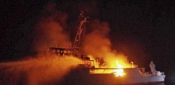 Japanese navy minesweeper sinks after fire off southwestern coast