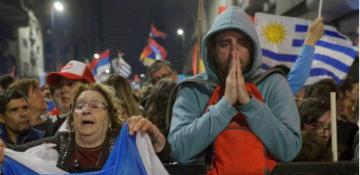 Uruguay holds a tight runoff election to choose its next president 