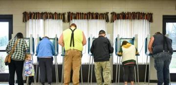 Exit polls: US voters name democracy and economy as top issues 