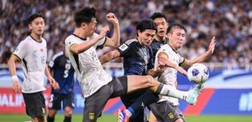 China loses to Japan in World Cup qualifier 