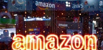Amazon, Intel, Chevron and Boeing rise premarket; Apple falls 