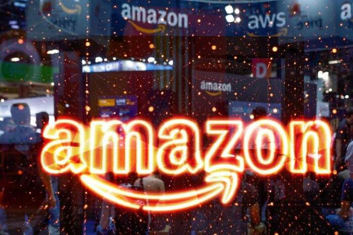 Amazon, Intel, Chevron and Boeing rise premarket; Apple falls 