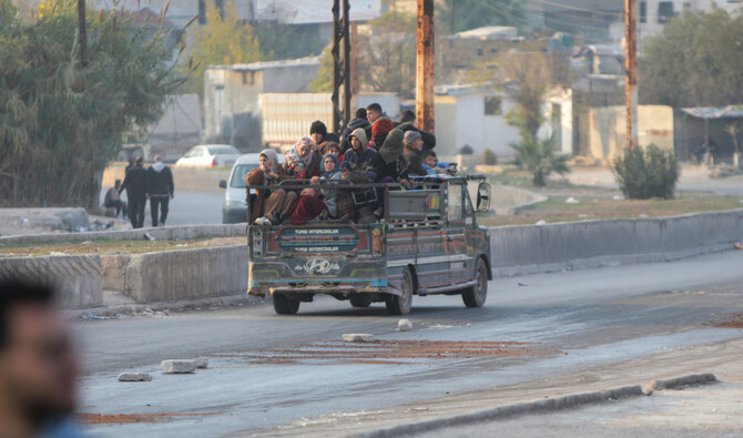 Thousands flee as rebel forces push toward Syria's Homs