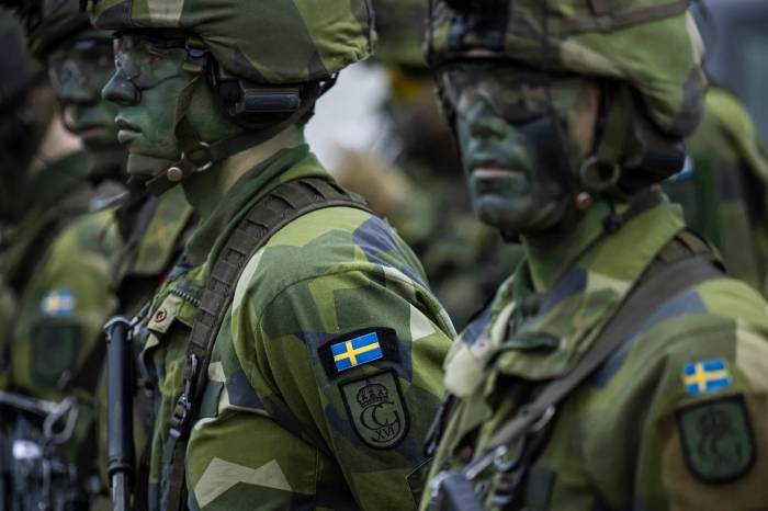 Sweden authorizes armed forces deployment to NATO for collective defense