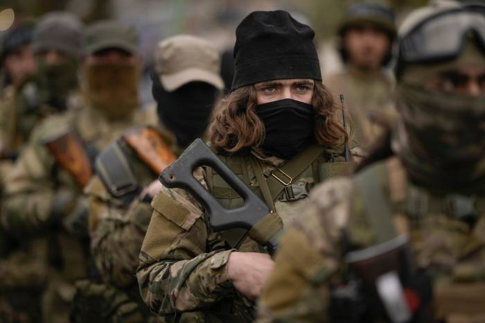 Syria enlists foreign fighters into its military, sources confirm 