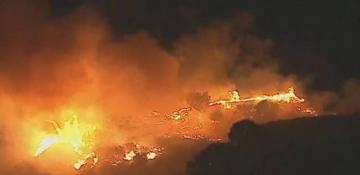 Santa Ana winds fuel brush fire in Jurupa Valley, prompt evacuations in southern California