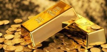 Gold edges lower ahead of Fed rate decision
