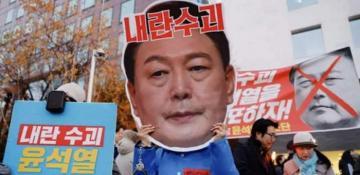 South Korean President banned from leaving country, stays in power 