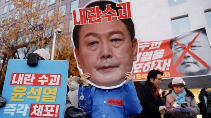 South Korean President banned from leaving country, stays in power 