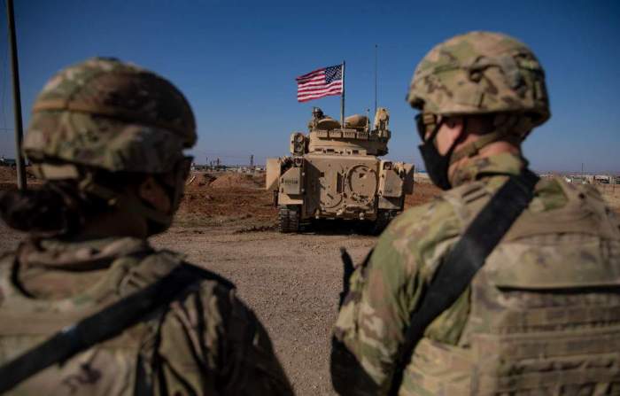 What drives US strategy to maintain troops in post-Assad Syria? 