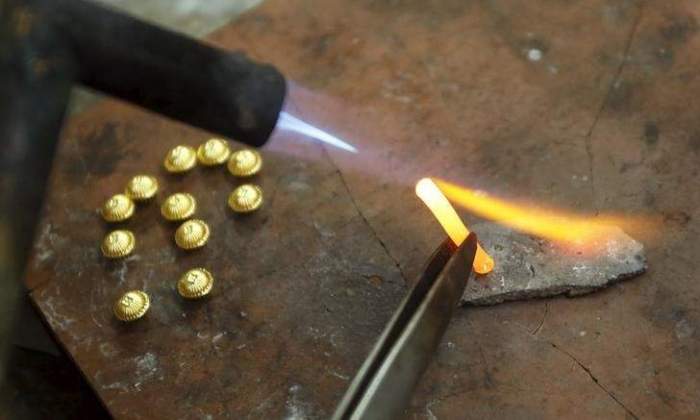 Gold prices rise after benign US CPI data; dollar weakens 