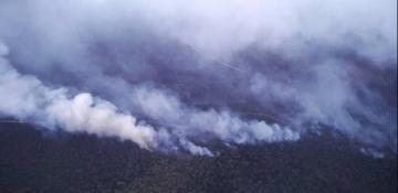 Firefighters battle fast-moving blazes in southeast Australia as thousands evacuate