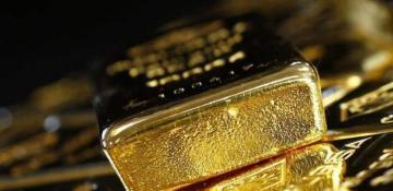 Gold prices steady as dollar jumps ahead of Fed rate decision 