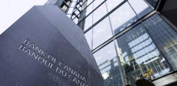 Bank of Canada lowers interest rates, warns of trade conflict impact 