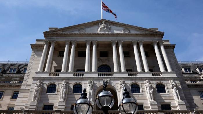 Bank of England cuts interest rates, lowers UK growth forecast