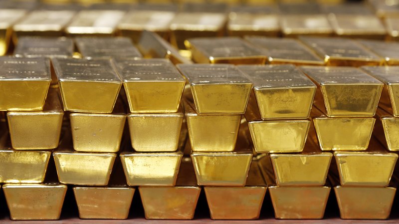 Gold holds steady amid profit-taking, supported by US data, trade concerns