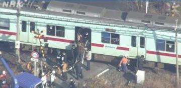 A train collides with a truck at a level crossing in Japan
