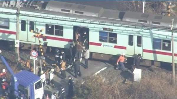 A train collides with a truck at a level crossing in Japan