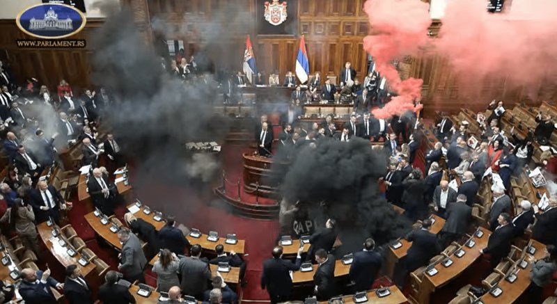 Chaos unfolds in Serbian parliament as MPs throw smoke bombs and brawl -  VIDEO 