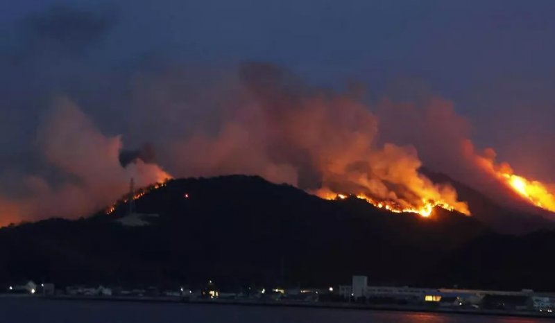 Wildfires in western Japan damage homes, forcing evacuations in two areas 