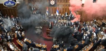Chaos unfolds in Serbian parliament as MPs throw smoke bombs and brawl -  VIDEO 