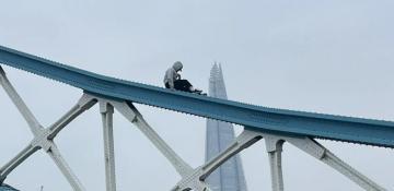 London's Tower Bridge temporarily closed after man climbs railings