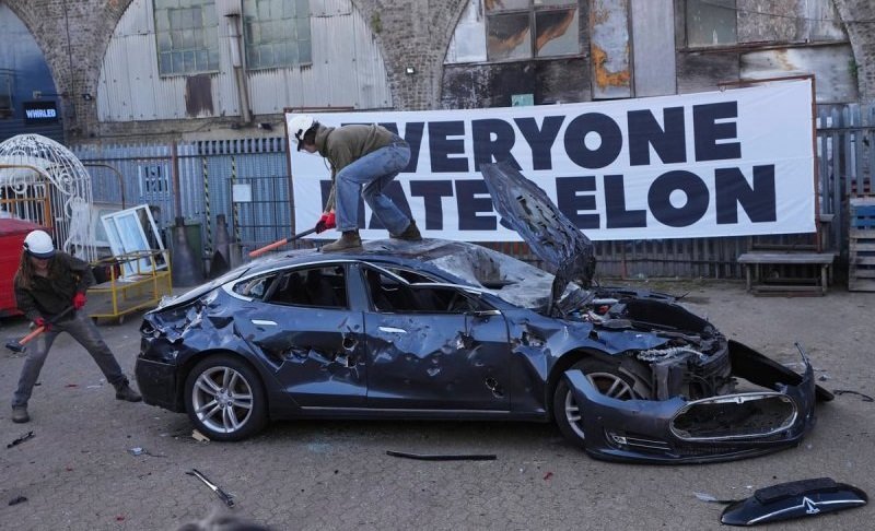 Activists destroy Tesla in London protest against Elon Musk -  VIDEO 