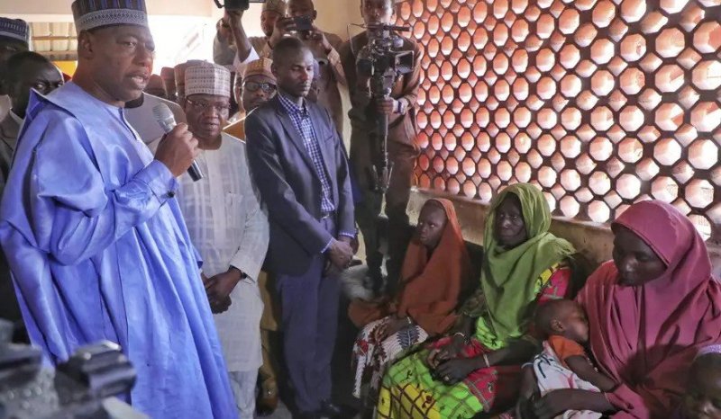 A roadside bomb blast kills 8 bus passengers in northeastern Nigeria