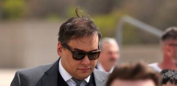 Former US congressman George Santos jailed for seven years