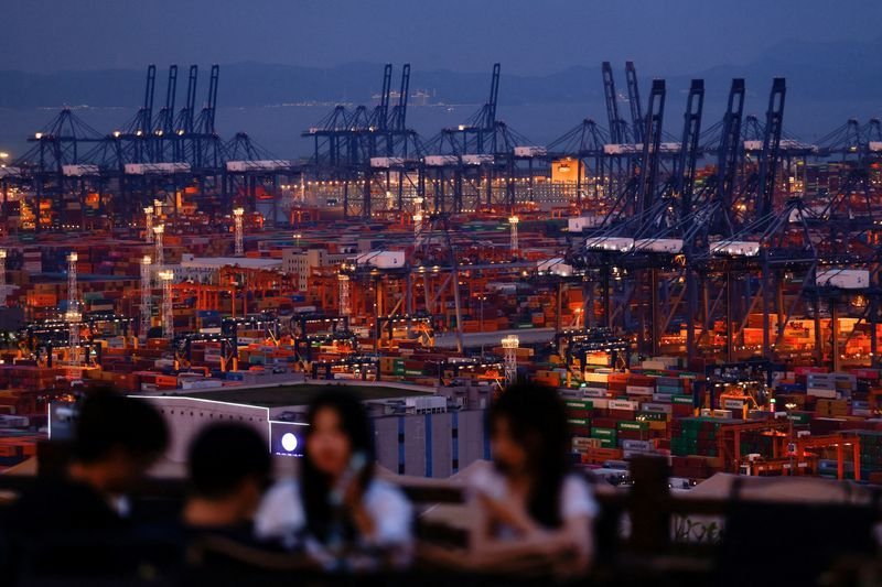 Wary investors hope US-China talks cool high-stakes trade war 