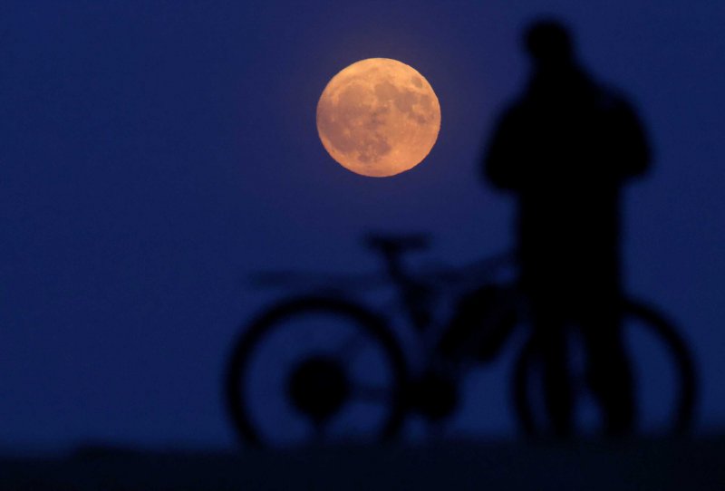 News about -  In Photos:  Strawberry Moon lights up the sky