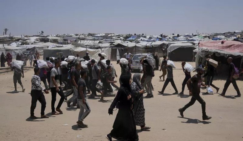 Palestinians report 5 killed near aid sites by Israeli fire; Israel claims only warning shots were fired