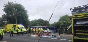 Dozen injured as bus carrying students crashes into river in southern England