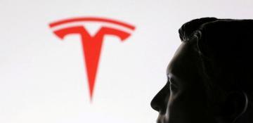 Tesla shares slip after double downgrade amid Trump feud fallout