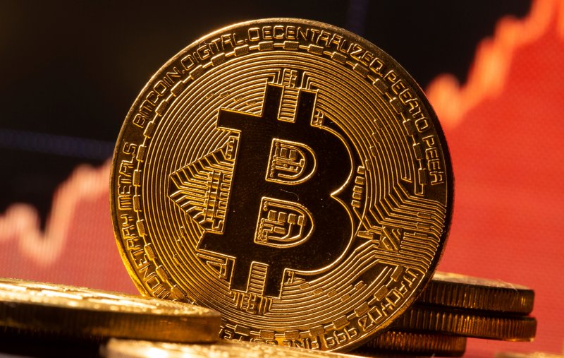 Bitcoin hits new record high amid growing demand