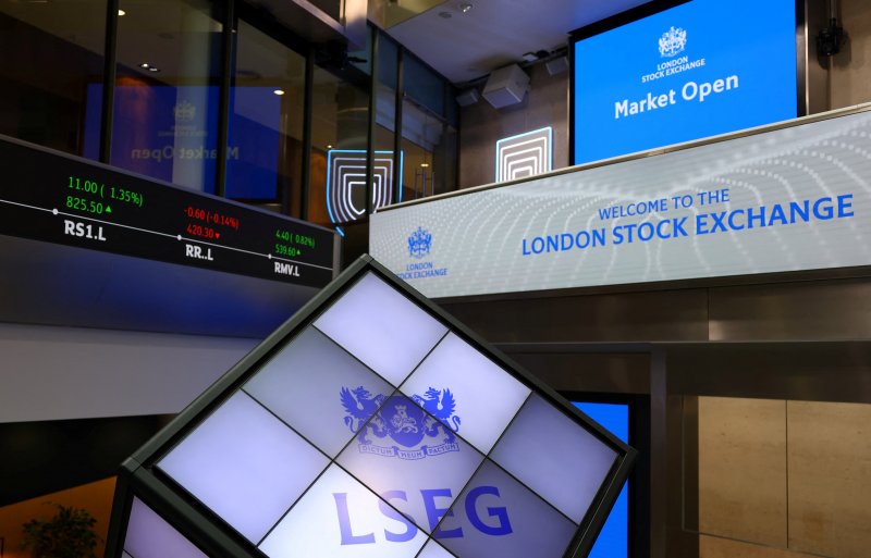 FTSE 100 surpasses 9,000 for the first time